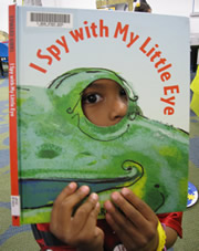 I Spy book and child